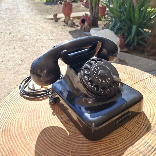 Collectible old-style telephone used, black, functional