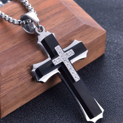 Elegant cross pendant with decorative stones and chain