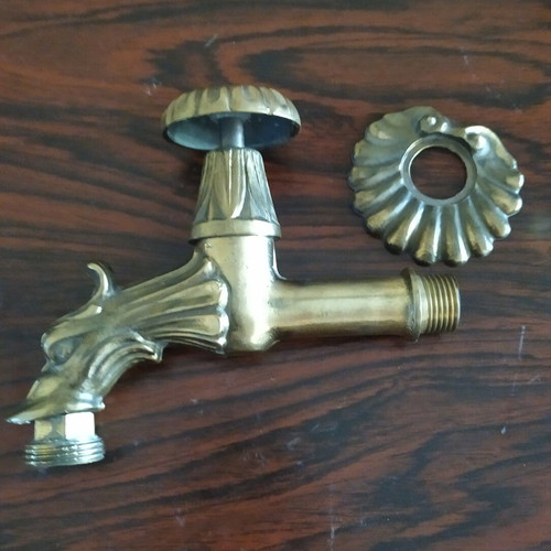 Brass garden faucet like new with decorative design