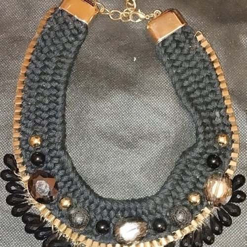 Knitted necklace new with black and gold beads
