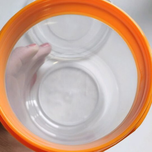 Storage container round like new, transparent with orange lid