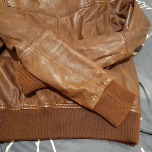 Brown leather women's jacket used with broken zipper
