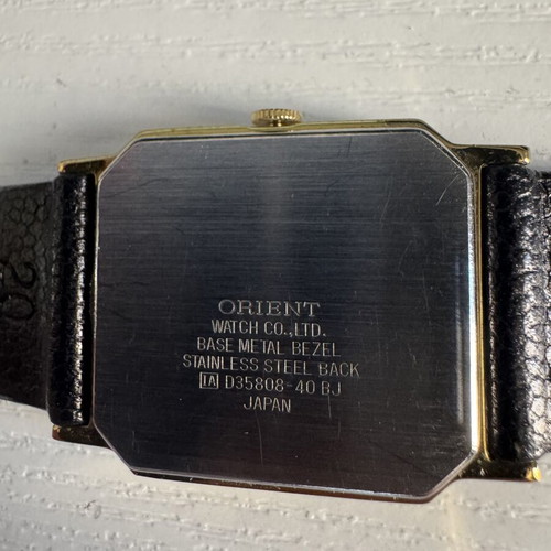 Orient VX Quartz watch, vintage gold rectangular case, brown leather strap