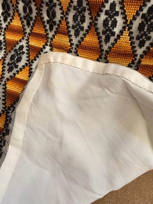 Embroidered table runner with diamond pattern