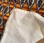 Embroidered table runner with diamond pattern