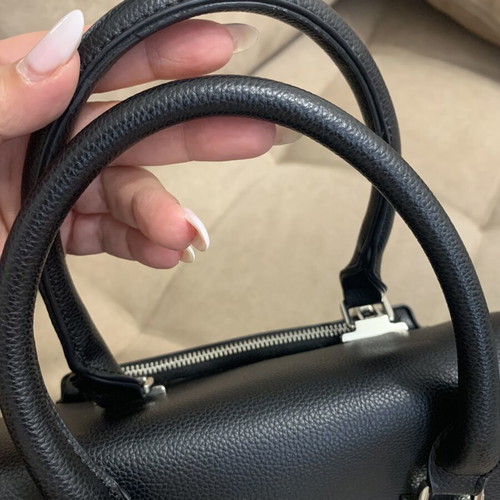 Black handbag with studs used, includes detachable pouch