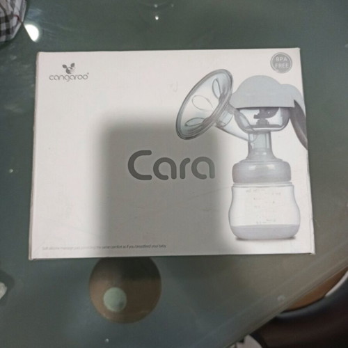 Cangaroo Cara manual breast pump like new with 30 Lansinoh milk storage bags