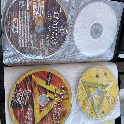 Vintage PC and PlayStation 2 gaming bundle with case, 70 CDs/DVDs