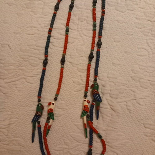 Wooden necklaces like new with beads and parrots, set of two