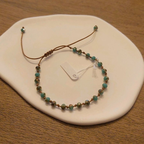 Handmade bracelet new with brown cord and turquoise crystals