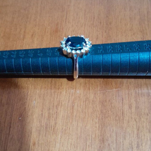 Ring with blue stone like new, silver color