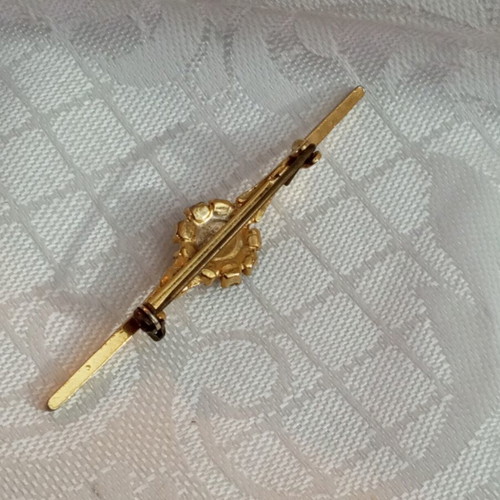 Vintage brooch with zircon and turquoise bead, used