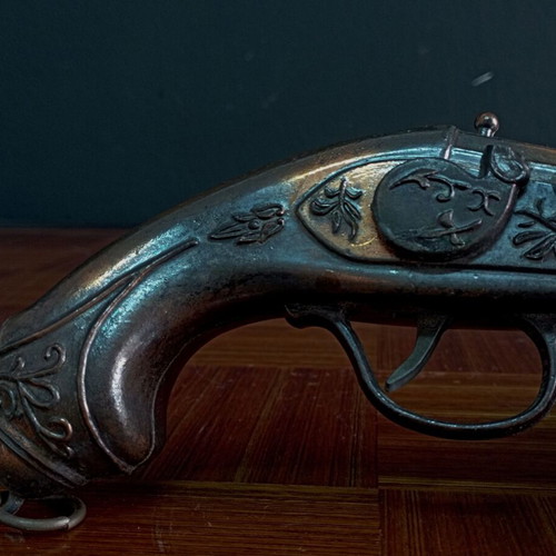 Vintage replica pistol used with engraved designs