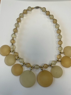 Statement necklace with large round beige-salmon beads used