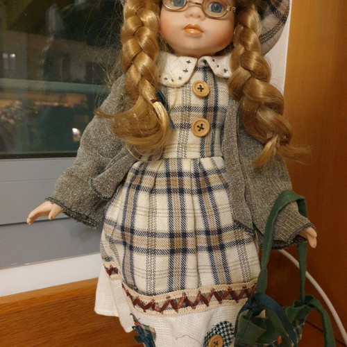 Porcelain dolls new with handmade clothes and support base