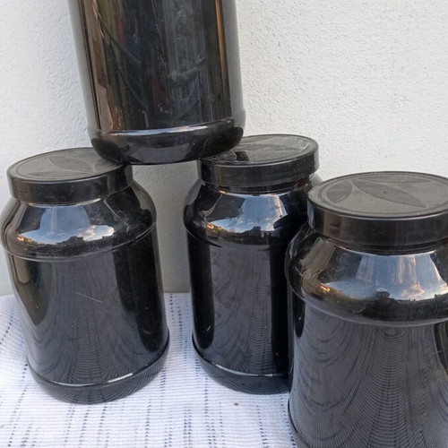 Plastic containers used, set of 4 with screw lid for food storage
