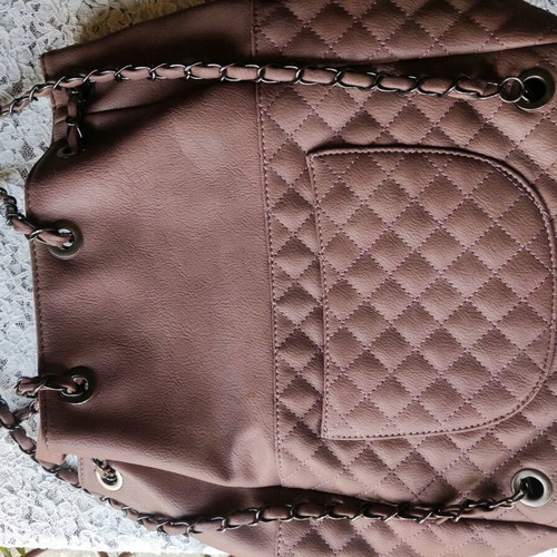 Backpack like new with quilted texture and handles