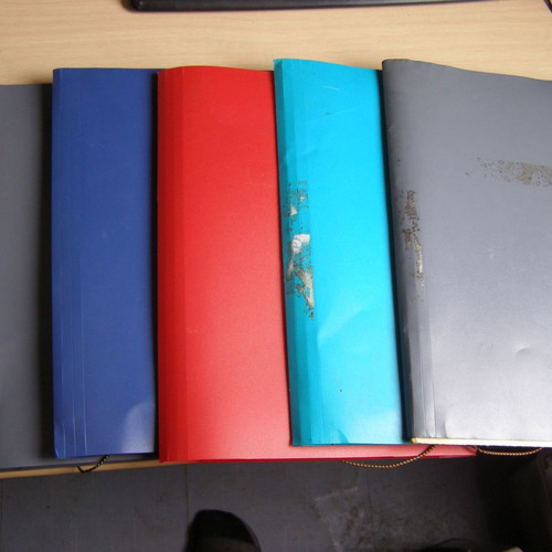 Plastic folders with elastic and tabs used, various colors
