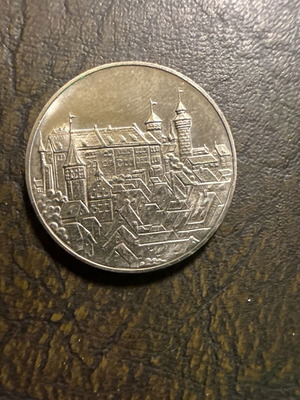 Collectible metal medal with embossed medieval castle design, new