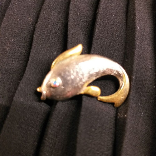 Dolphin pin used, silver and gold color