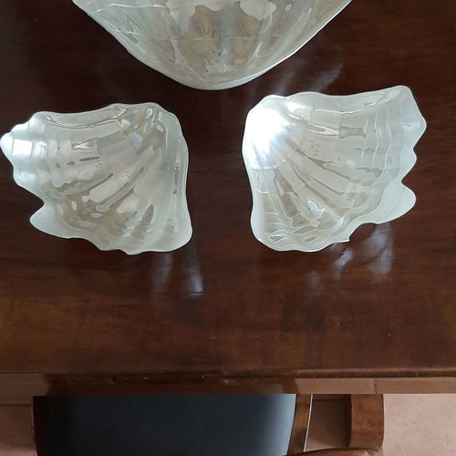 Three platters in the shape of a conch