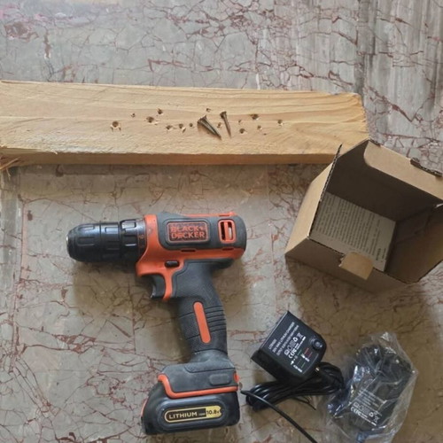Black & Decker cordless drill used with 10.8V battery and charger