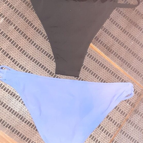 Two women's swimsuits new, one blue and one black, sizes XS and S