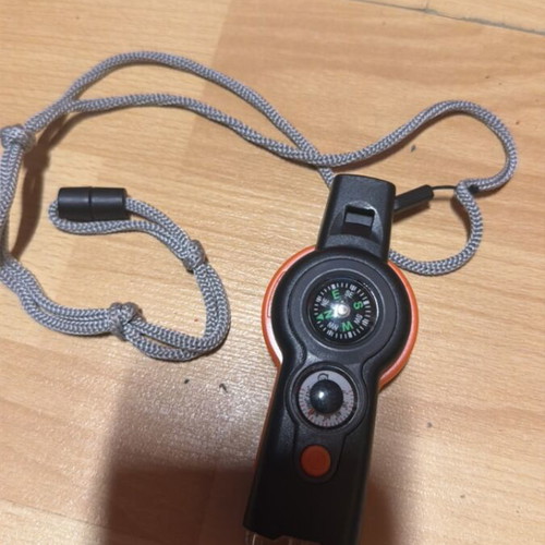 Lanyard with whistle, compass and LED used