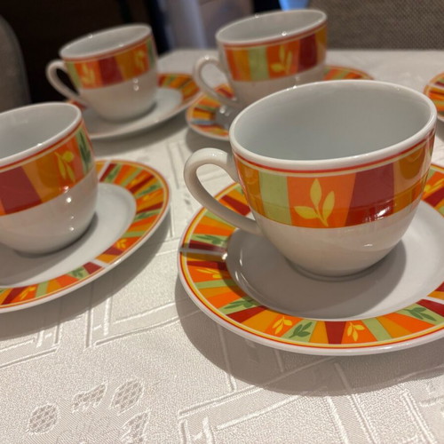 Vintage set of 6 cups and 6 saucers with bright colors, unused