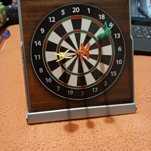 Tabletop dartboard unused with 3 darts