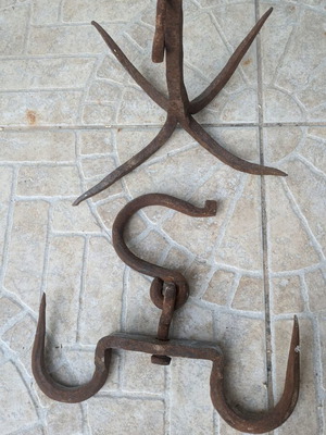 Vintage forged iron meat hooks and anchor