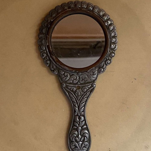 Handheld toilet mirror used with embossed peacock design