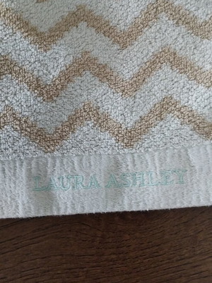 Laura Ashley face towel like new with geometric pattern light blue beige