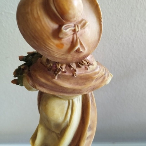 Vintage Italian decorative statue of a girl with roses, used