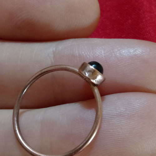 Ring with black stone in copper color, like new, inner diameter 16