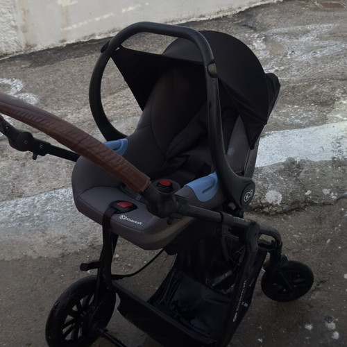 Kinderkraft 3-in-1 grey stroller with car seat