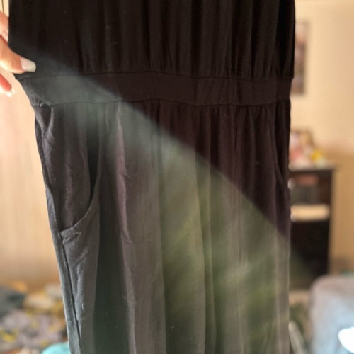 One-piece black jumpsuit with green strap like new, size M