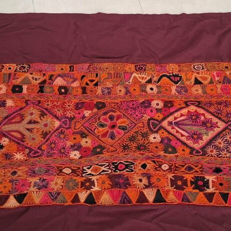 Handmade woven cover like new in red shades