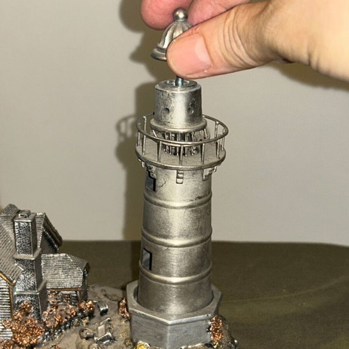 Vintage metal lighthouse decorative miniature with hidden compartment, like new