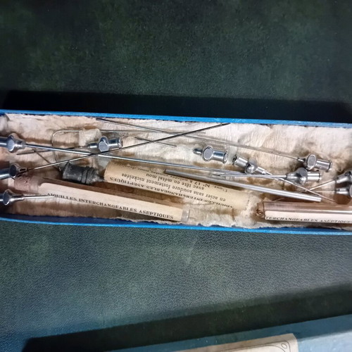Antique glass syringe used with needle box