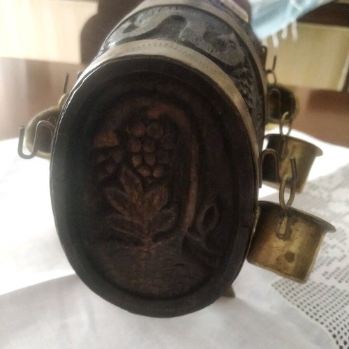 Antique barrel used with brass cups and carvings