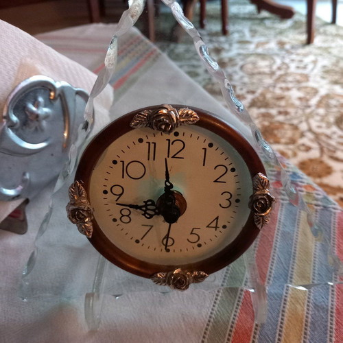 Decorative clock used, tabletop with wooden and glass base