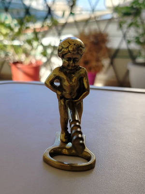 Brass corkscrew opener used with minor metal wear