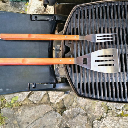 Barbecue set used with stainless steel fork and spatula with wooden handles