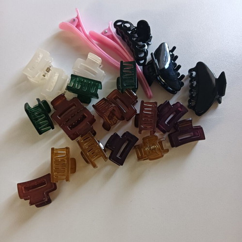 Mini hair clips in various colors and sizes, unused