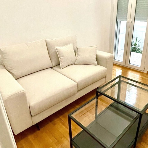 White two-seater sofa