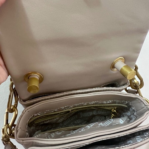 Juicy Couture small crossbody bag nude color with gold design like new