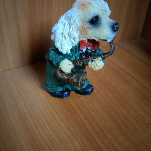 Decorative dog figure with saxophone like new