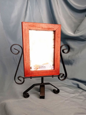 Rotating wooden photo frame with metal decorative base like new