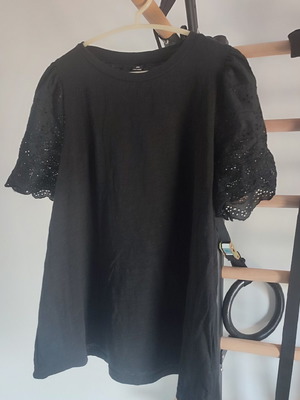 Black blouse with embroidered sleeves